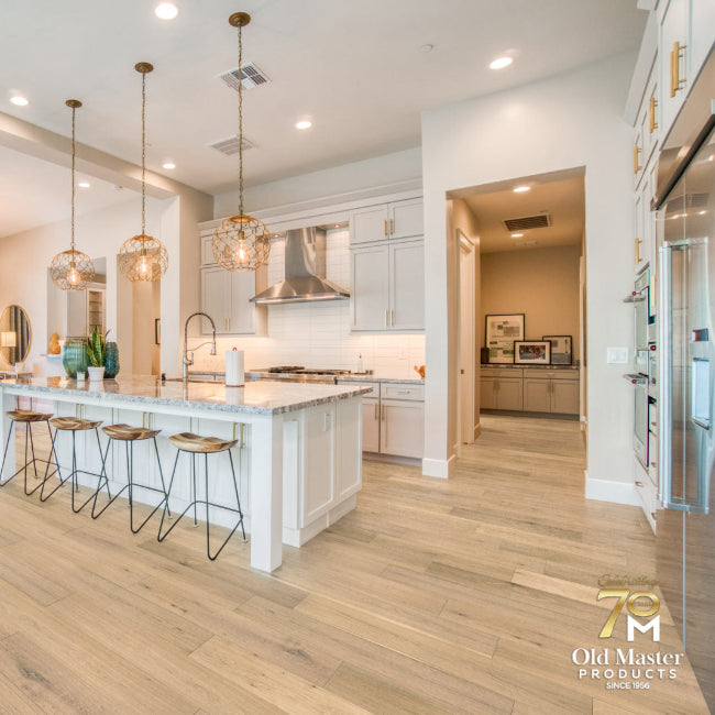 Modern kitchen with island and dining area in a well-lit room