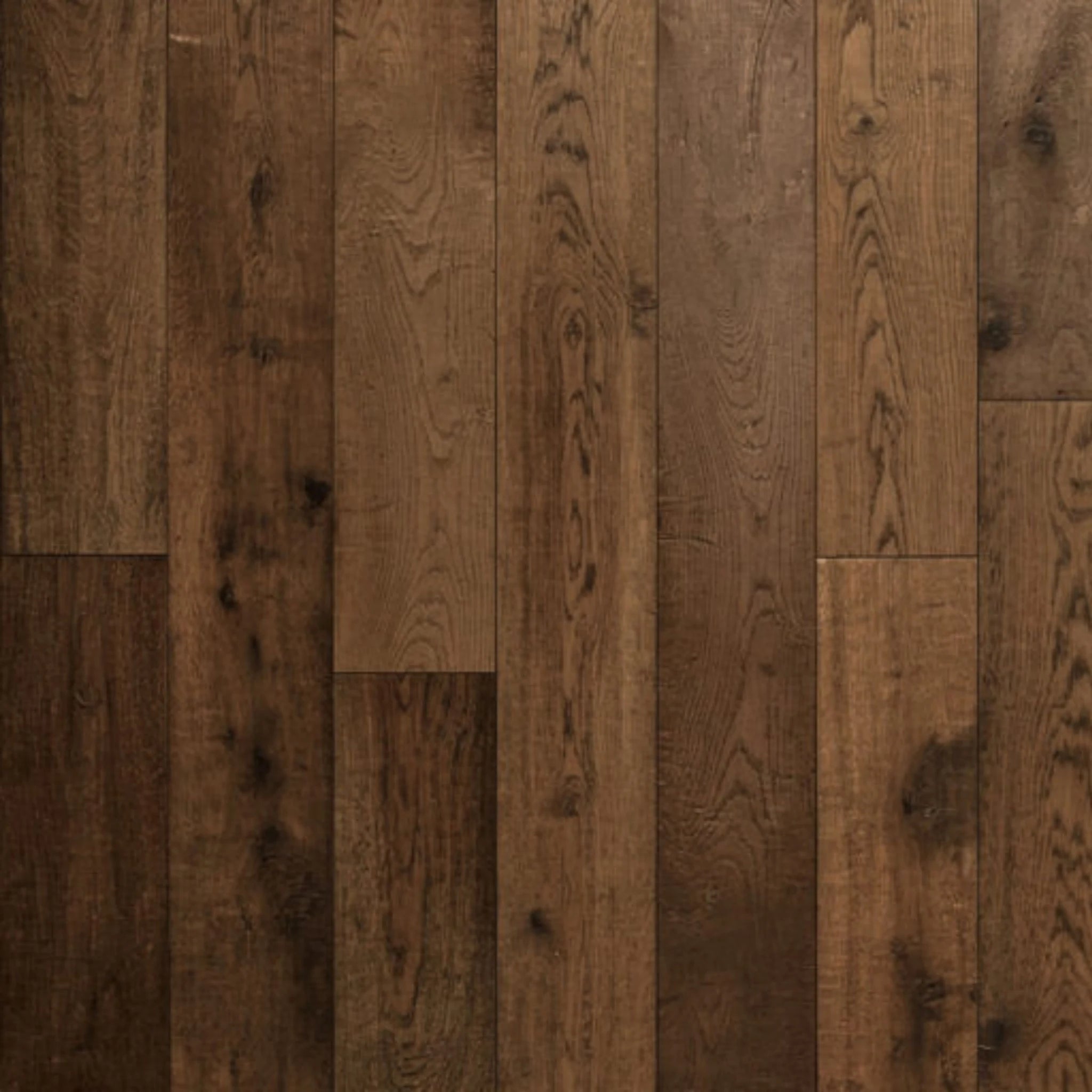 Close-up of wooden flooring with a warm brown color and visible grain.