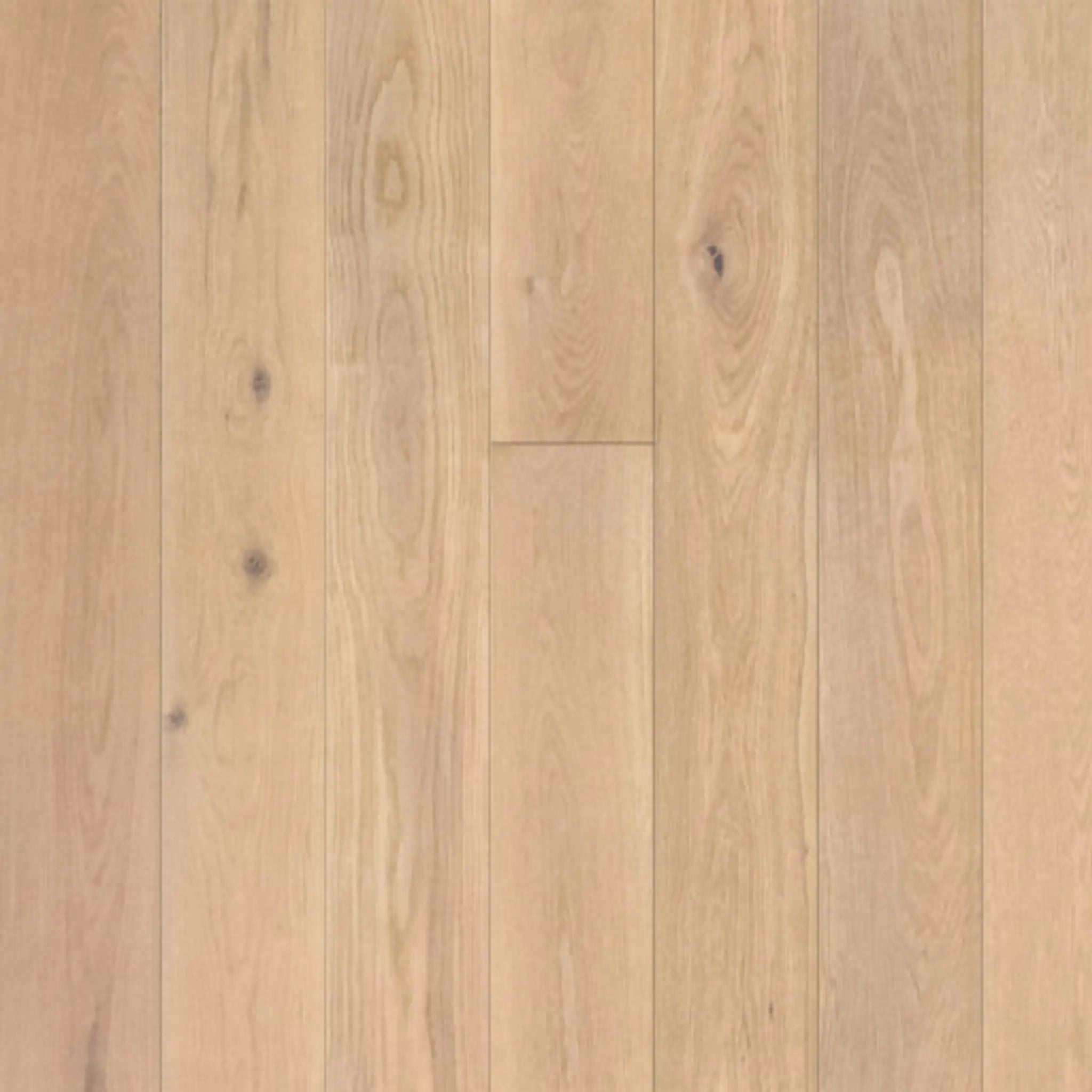 Close-up of a wooden floor with a light brown color and visible grain pattern.